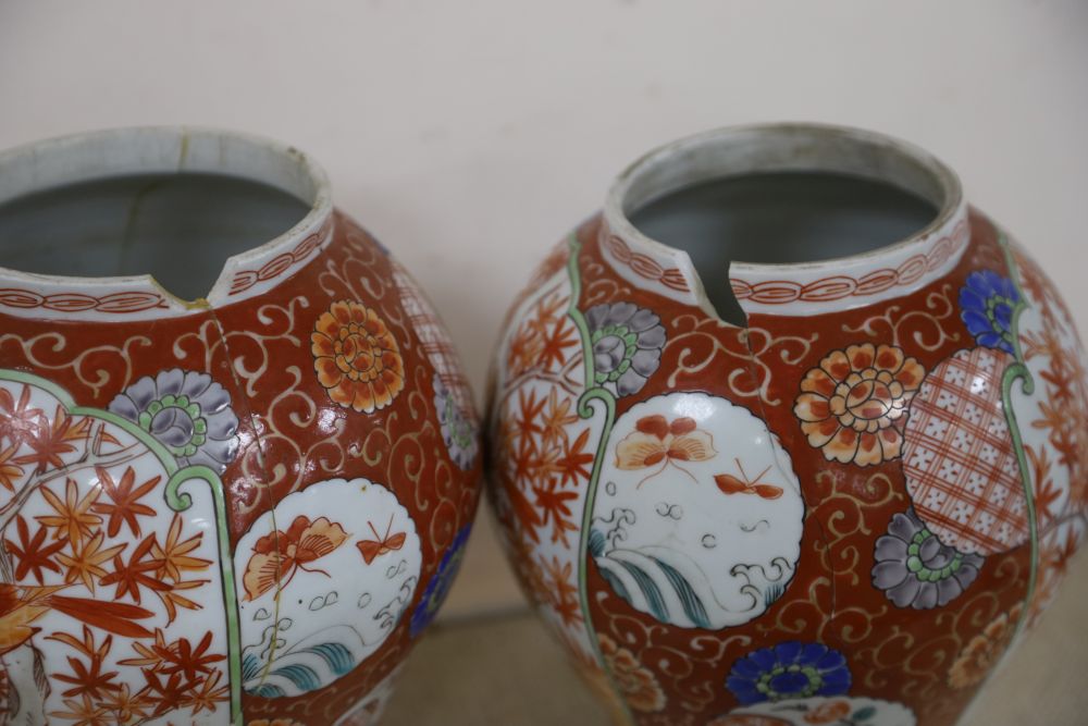 A near pair of Japanese porcelain lidded vases